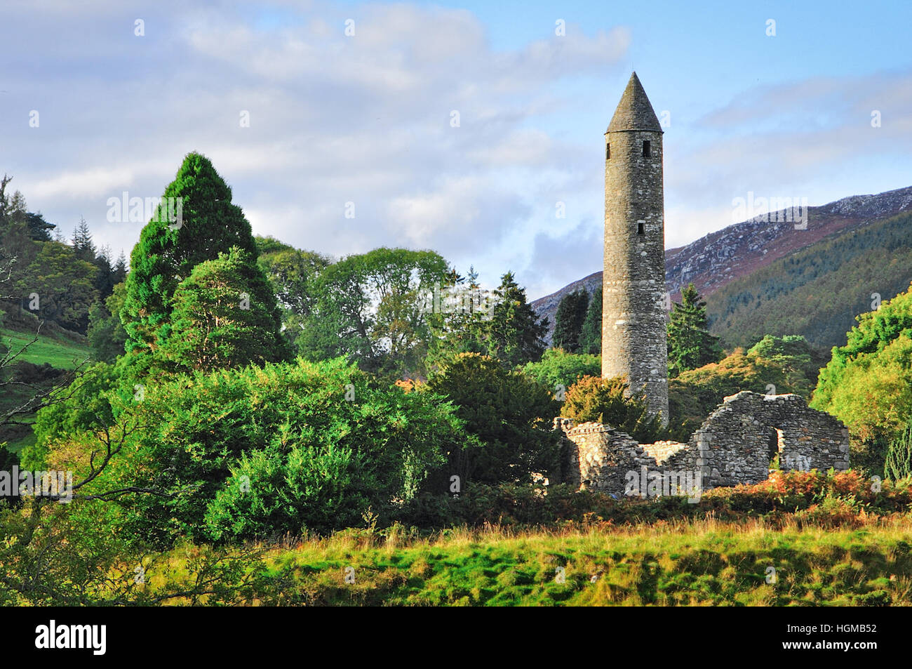 The Round Tower and Monastic City at Glendalough in County Wicklow in Ireland Stock Photo