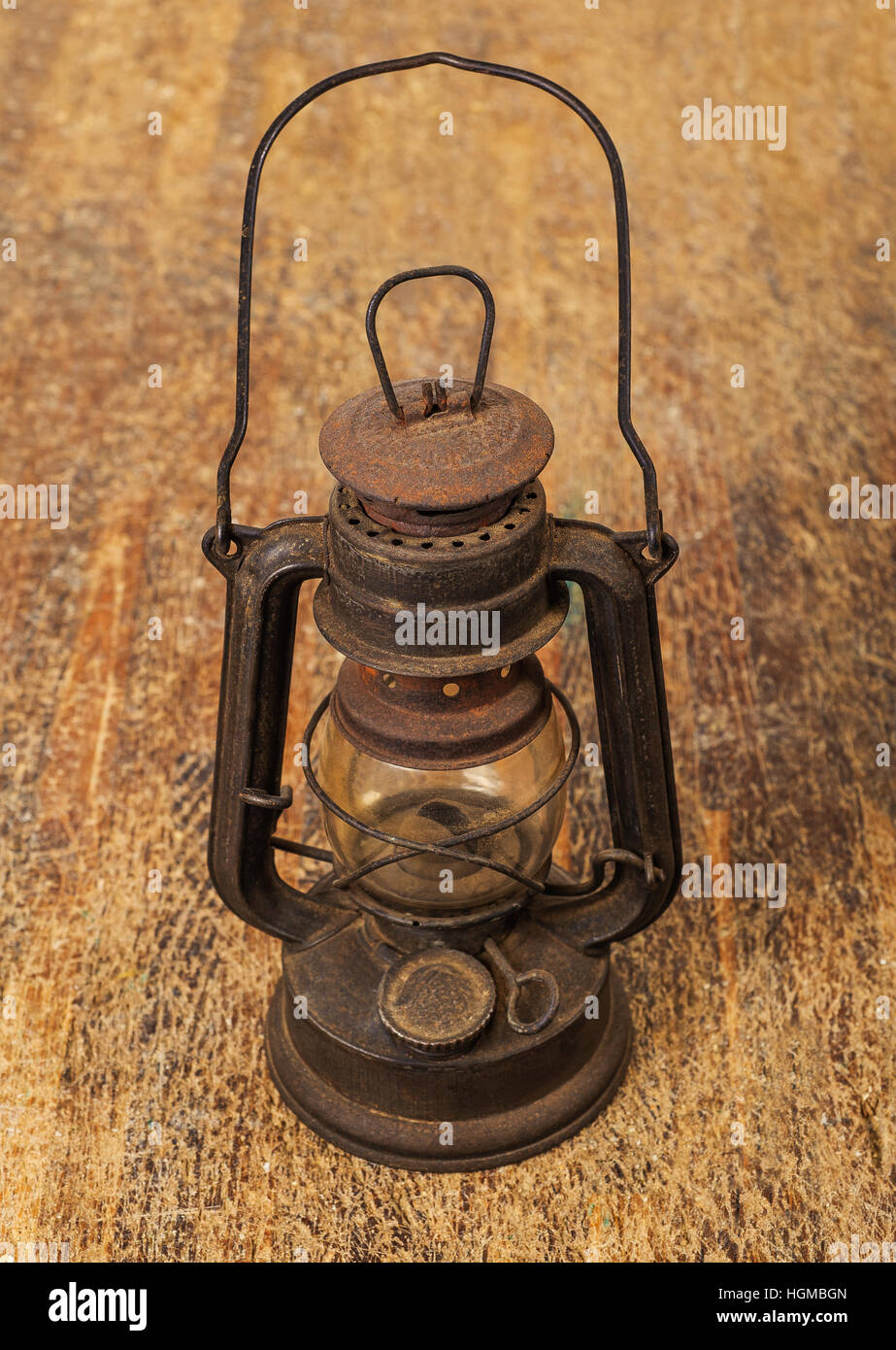 old rusty  lamp on wood background Stock Photo