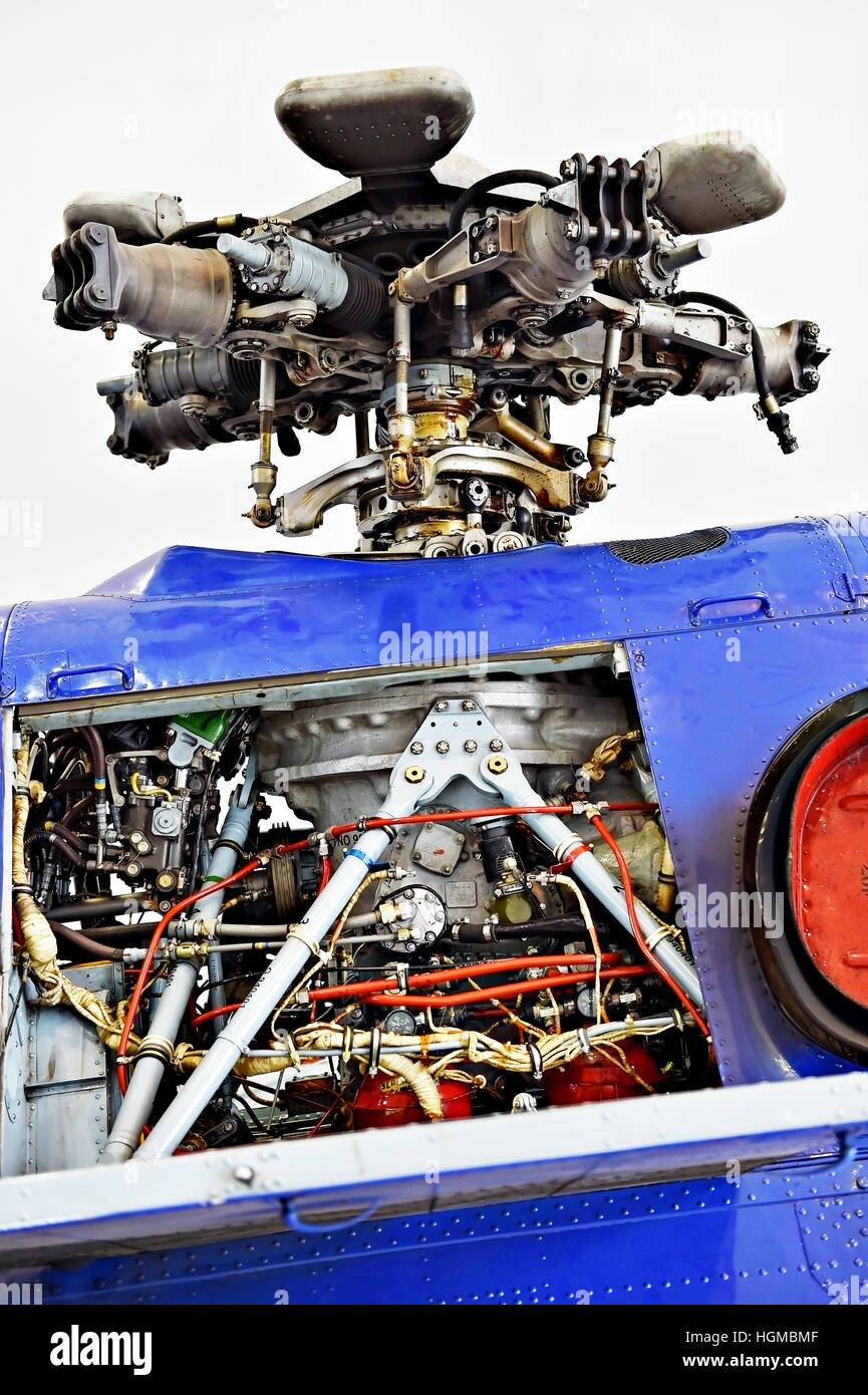 Detail with helicopter fuselage and rotor blade system on repair line