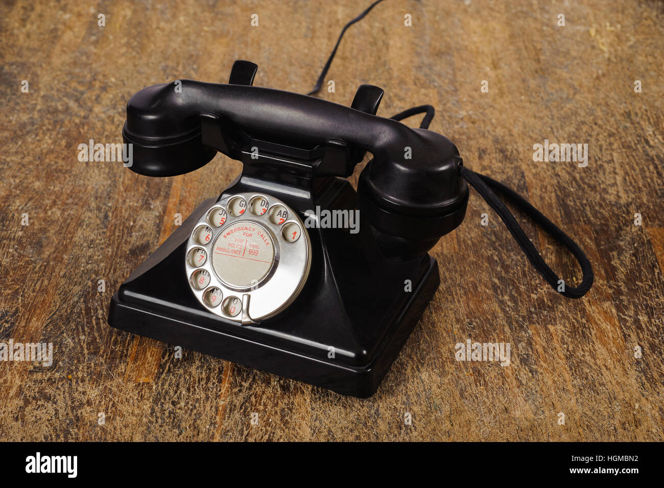 Black Old phone on wood background Stock Photo