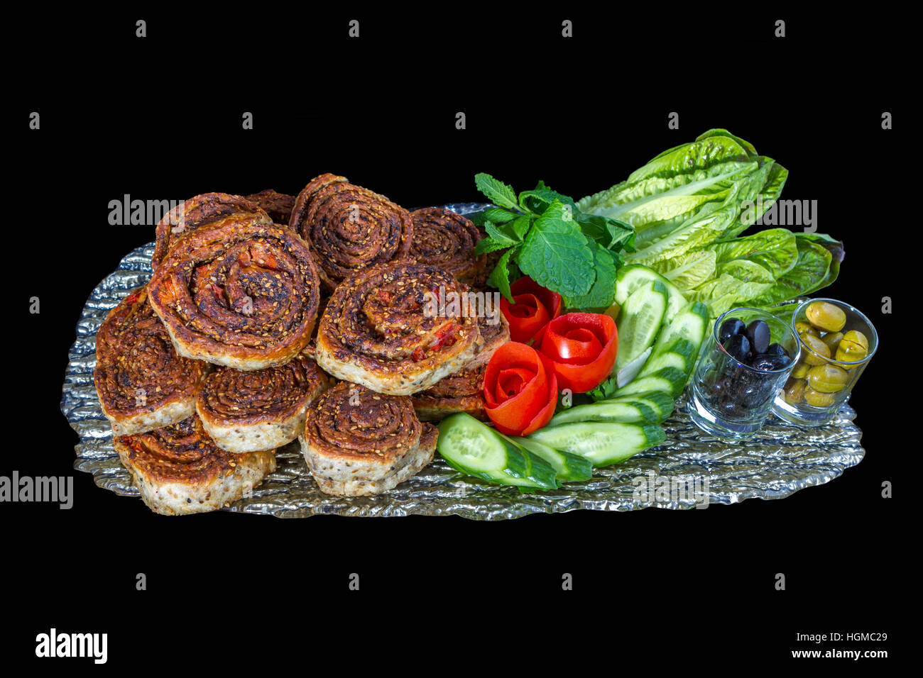 A Lebanese food that is perfect for breakfast. Freshly baked and out of the clay oven. A healthy snack with vegetables. Stock Photo
