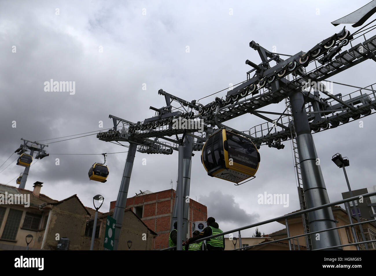 (17081) -- LA PAZ, Jan. 8, 2017 (XINHUA) -- Photo taken on Jan. 8, 2017 shows the cable cars of yellow line commuting in La Paz, capital of Bolivia. The aerial cable transport system linking the cities of La Paz and El Alto emerges as an alternative to public transport, given the growing demand of people in two cities. (Xinhua/Li Ming)(zf) Stock Photo