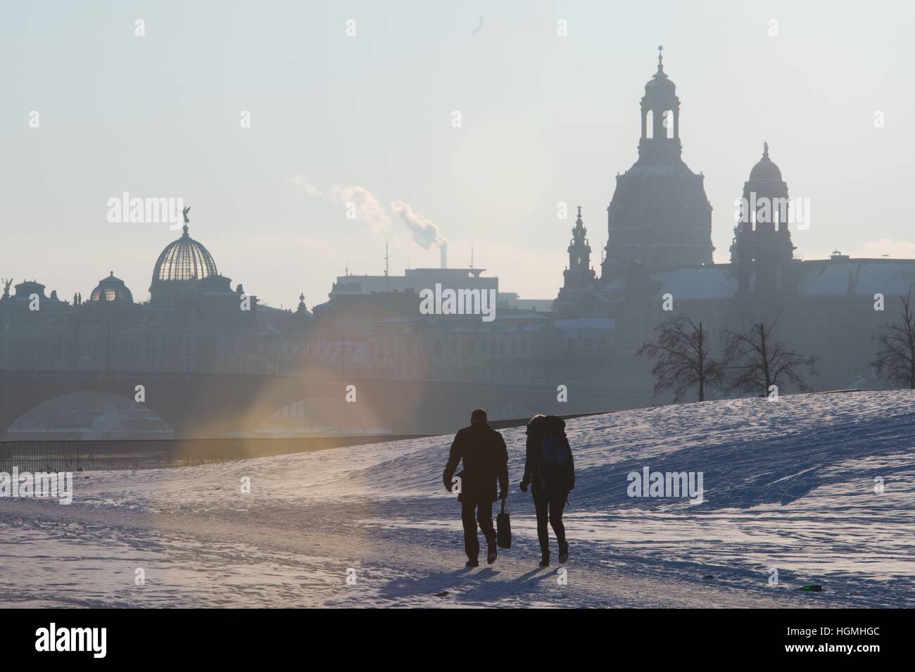 Dresden, Germany.Replace withPeople walk through the snow with the