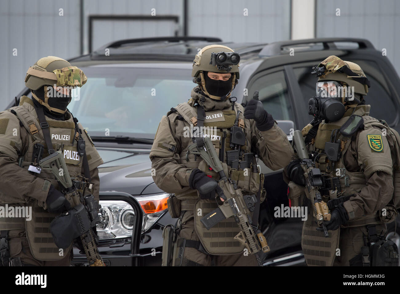 Dresden, Germany. 11th Jan, 2017. Three members of the pecial police