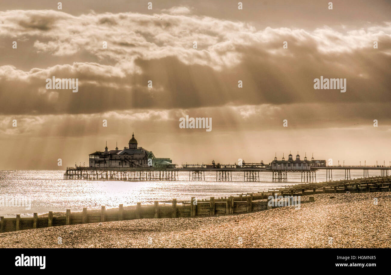 Eastbourne, East Sussex, UK. 11th Jan, 2017. Suns rays break through the clouds over the Pier. Stock Photo