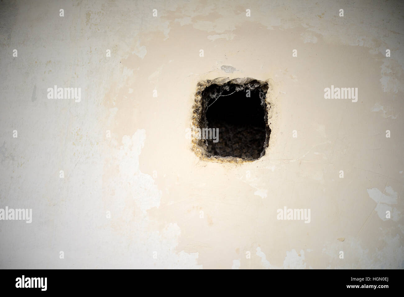 hole in in wall as a background Stock Photo