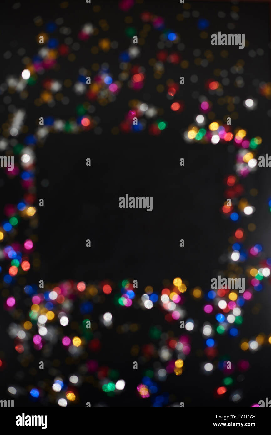 Confetti on the black background Stock Photo - Alamy