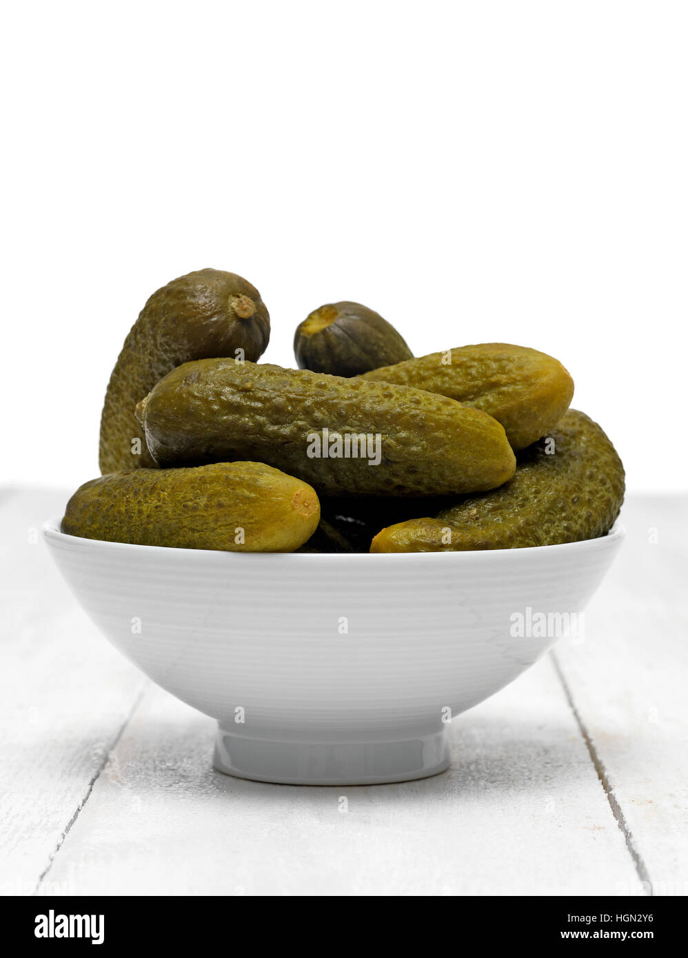 Gherkin in bowl on table top Stock Photo