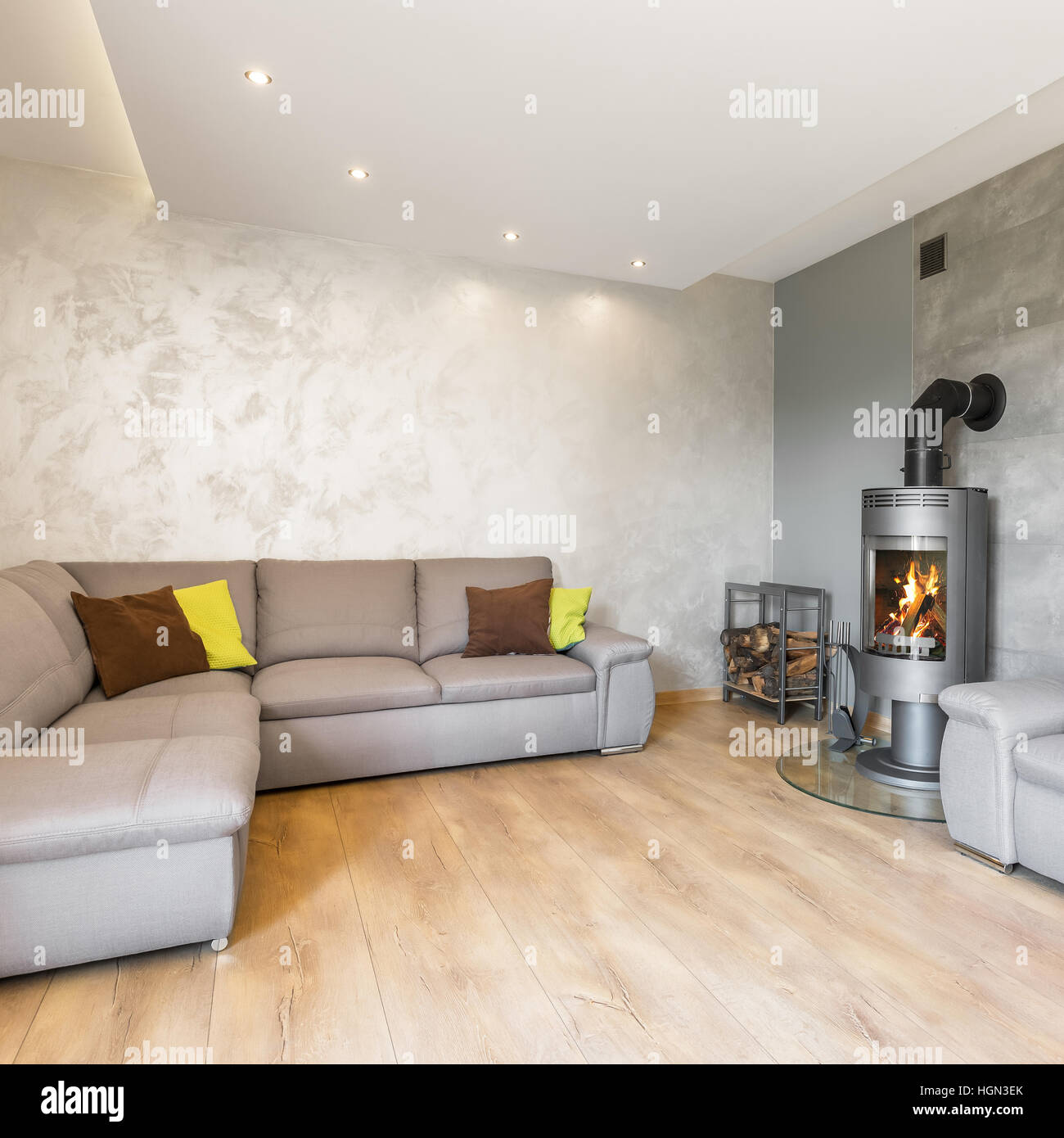 Spacious living room with extra large sofa, fireplace and decorative