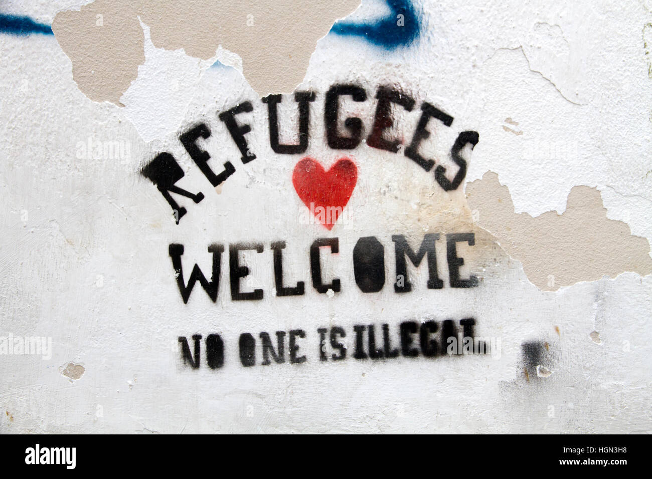 Refugees welcome write on wall Andalusia Spain Stock Photo