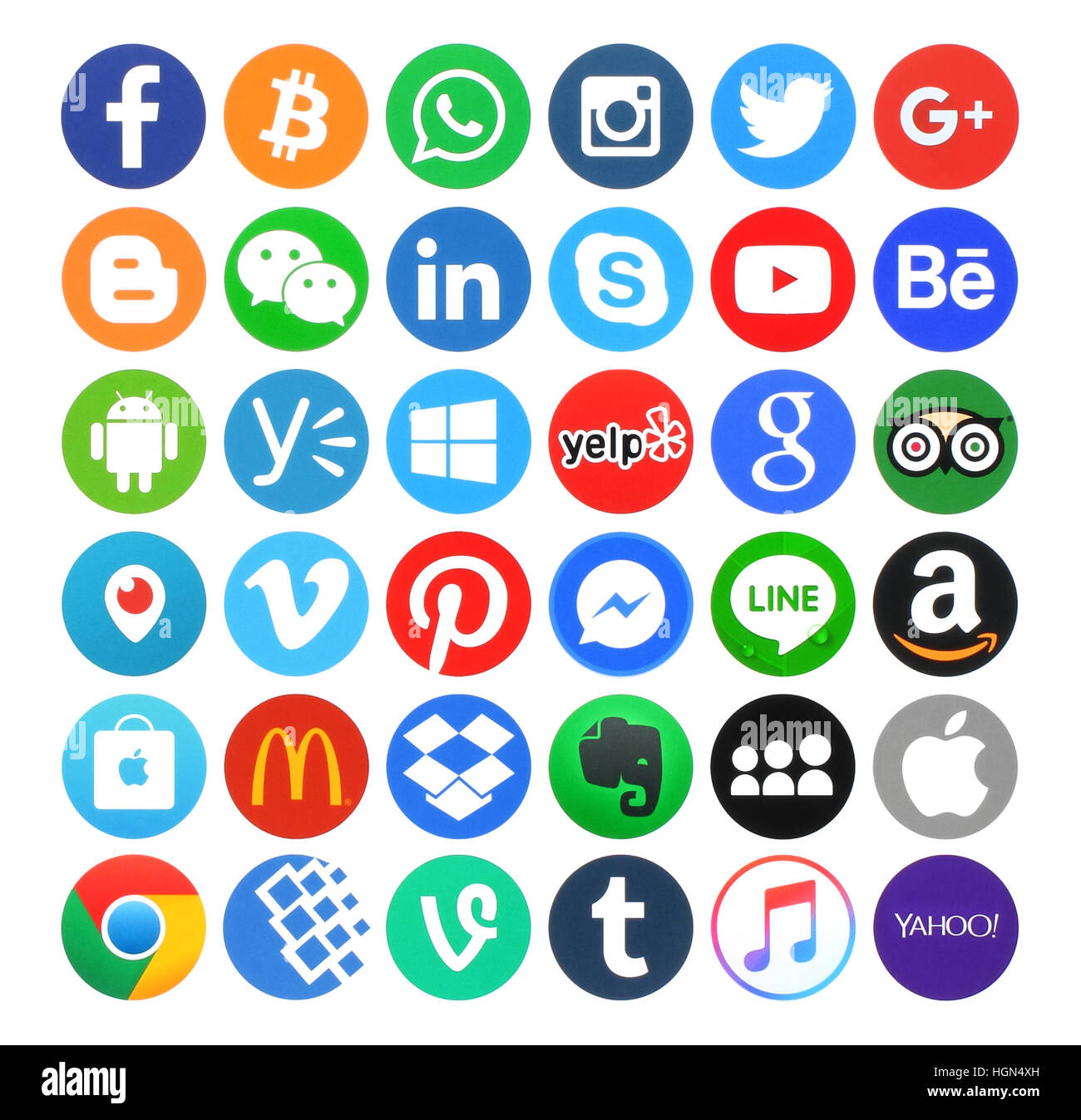 Kiev, Ukraine - May 14, 2016: Collection of popular 36 round icons, printed on paper, of social networking, productivity, food, travel, music, operati Stock Photo