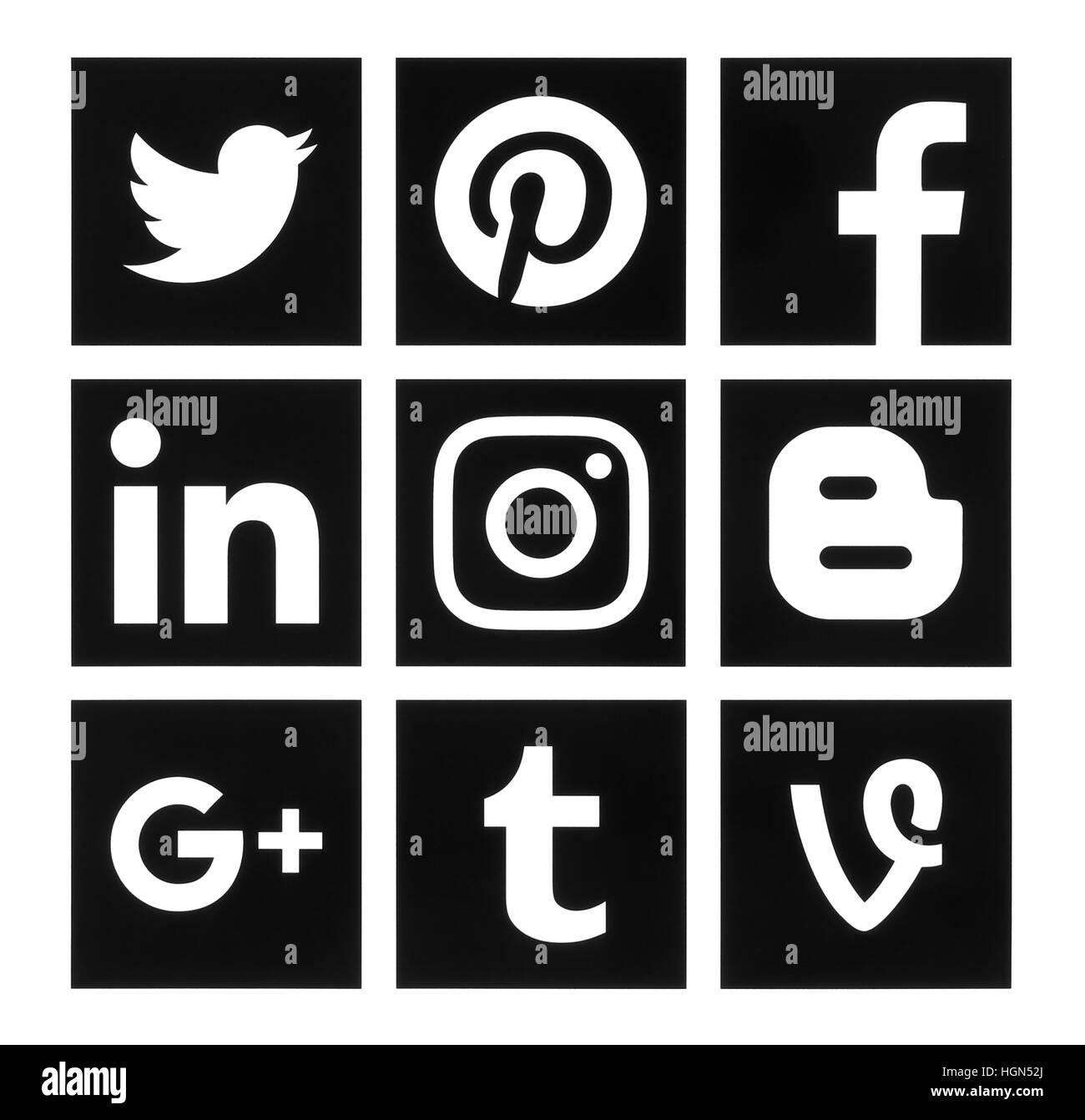 Kiev, Ukraine - October 10, 2016: Collection of popular square black social media logos printed on paper: Facebook, Twitter, Google Plus, Instagram, P Stock Photo