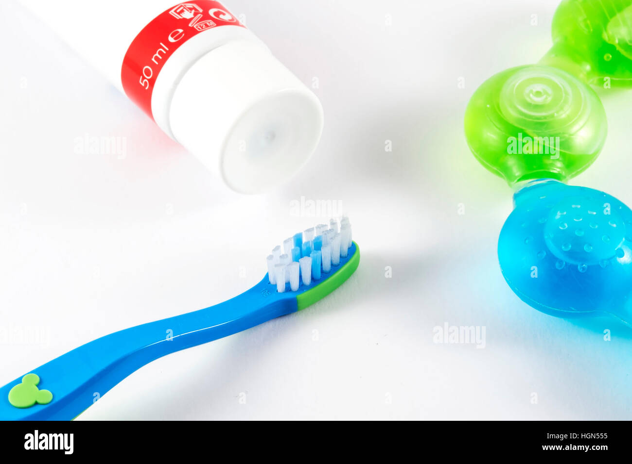 Baby toothbrush and toothpaste on white background Stock Photo Alamy