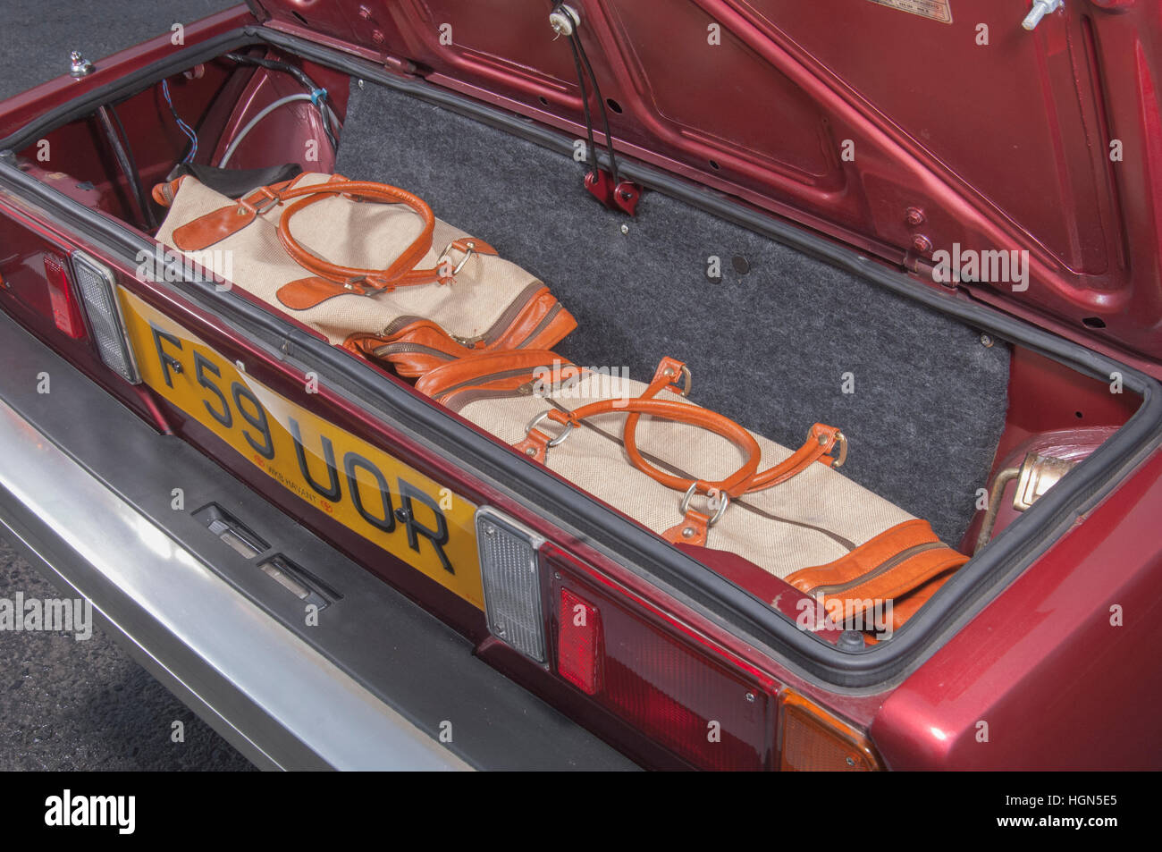 Luggage in the boot of a 1988 Fiat X1/9 mid engined sports car, designed by Bertone Stock Photo