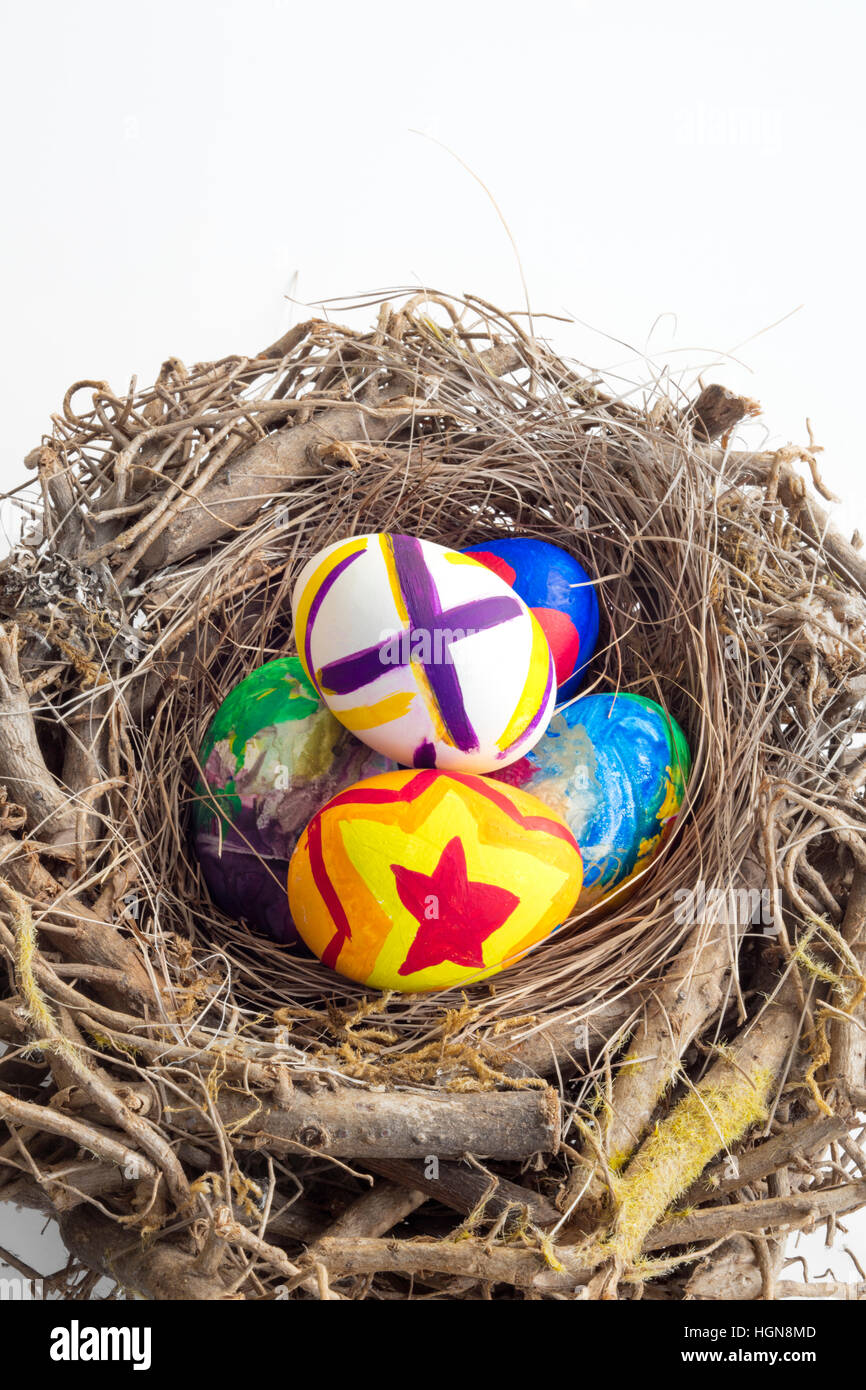Detail of painted Easter eggs placed in a nest with different forms and ...
