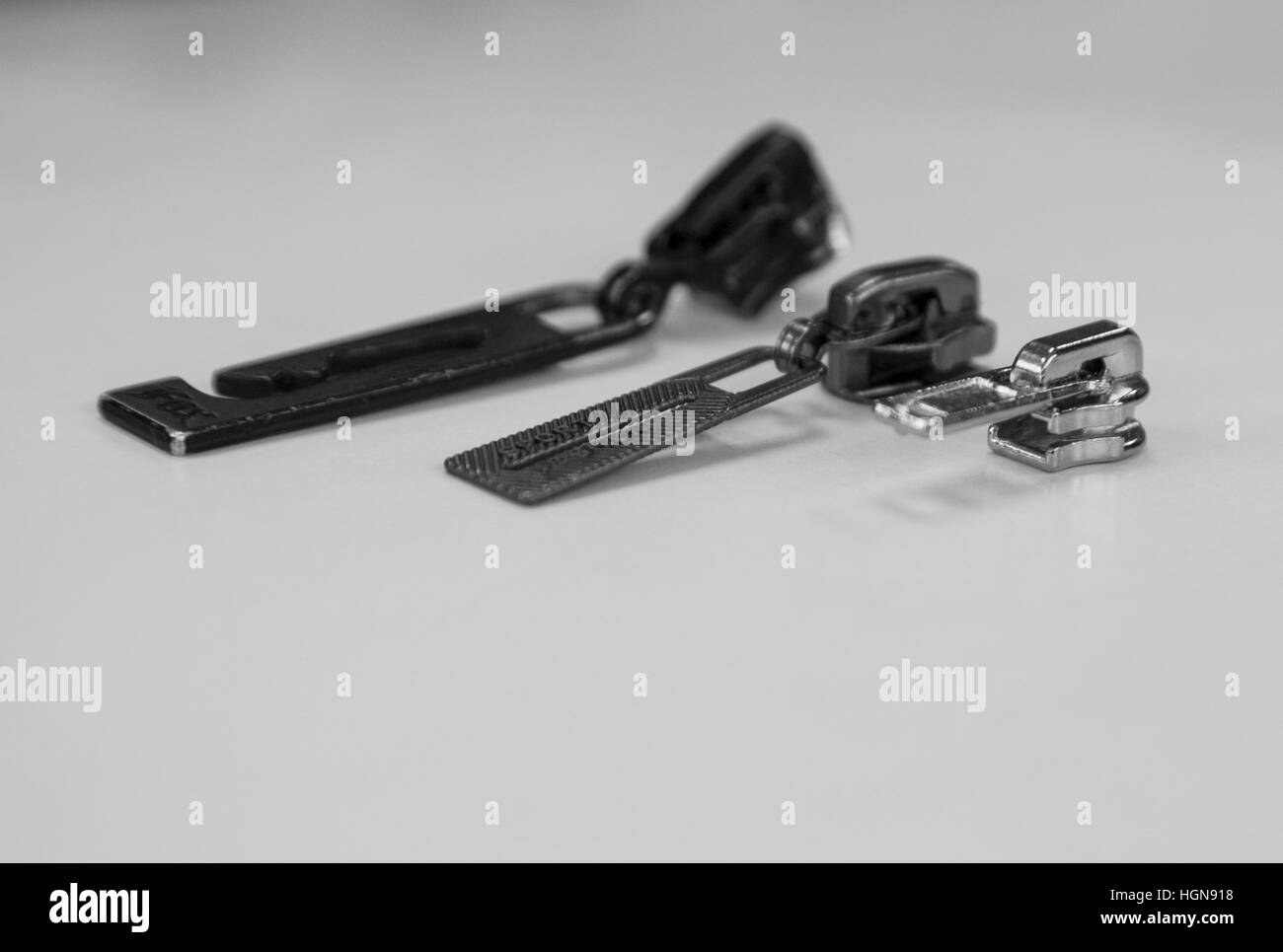 three zippers all different sizes Stock Photo Alamy