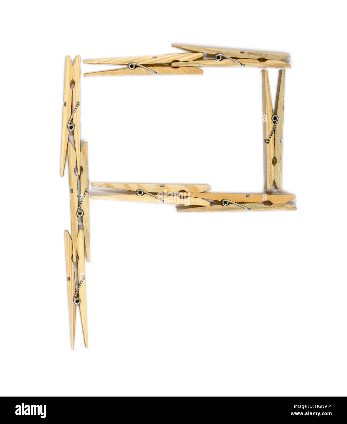 Letter P made of wooden clothespins isolated on white Stock Photo