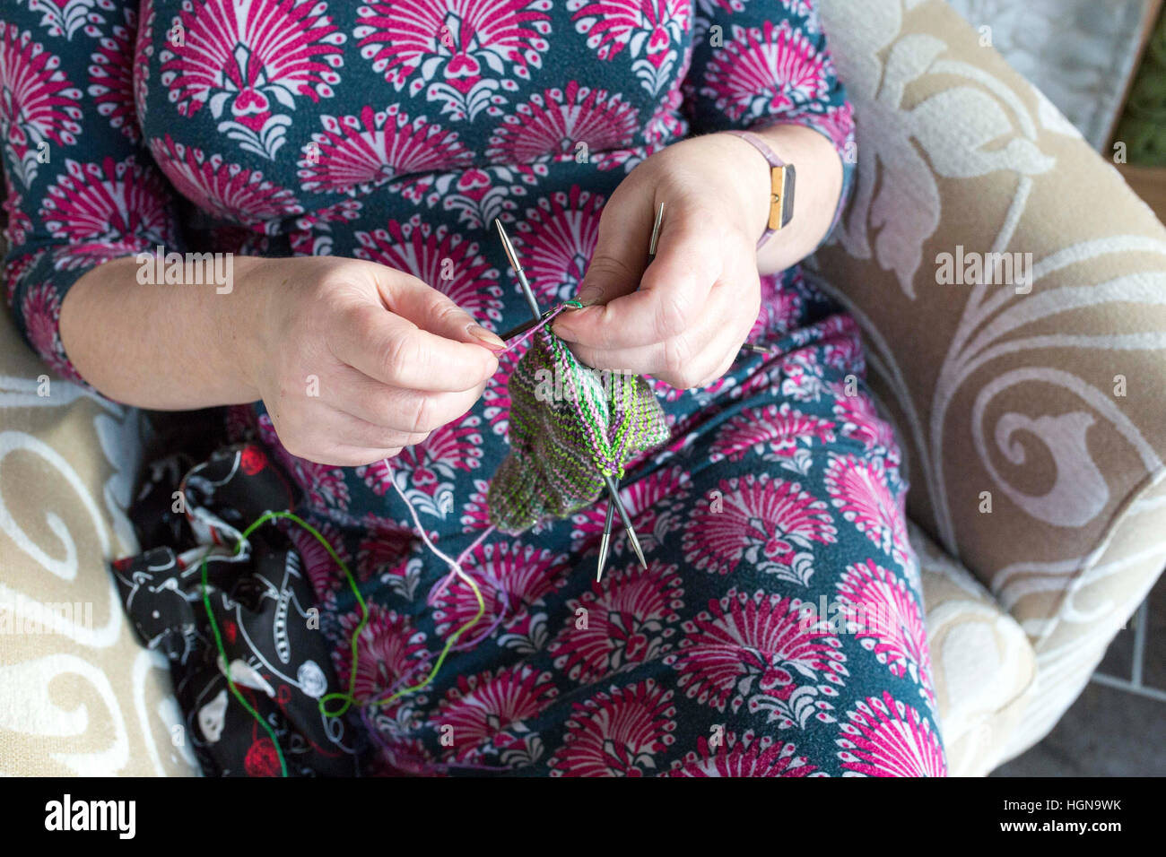 Knitting - close up of a lady's hands knitting Stock Photo