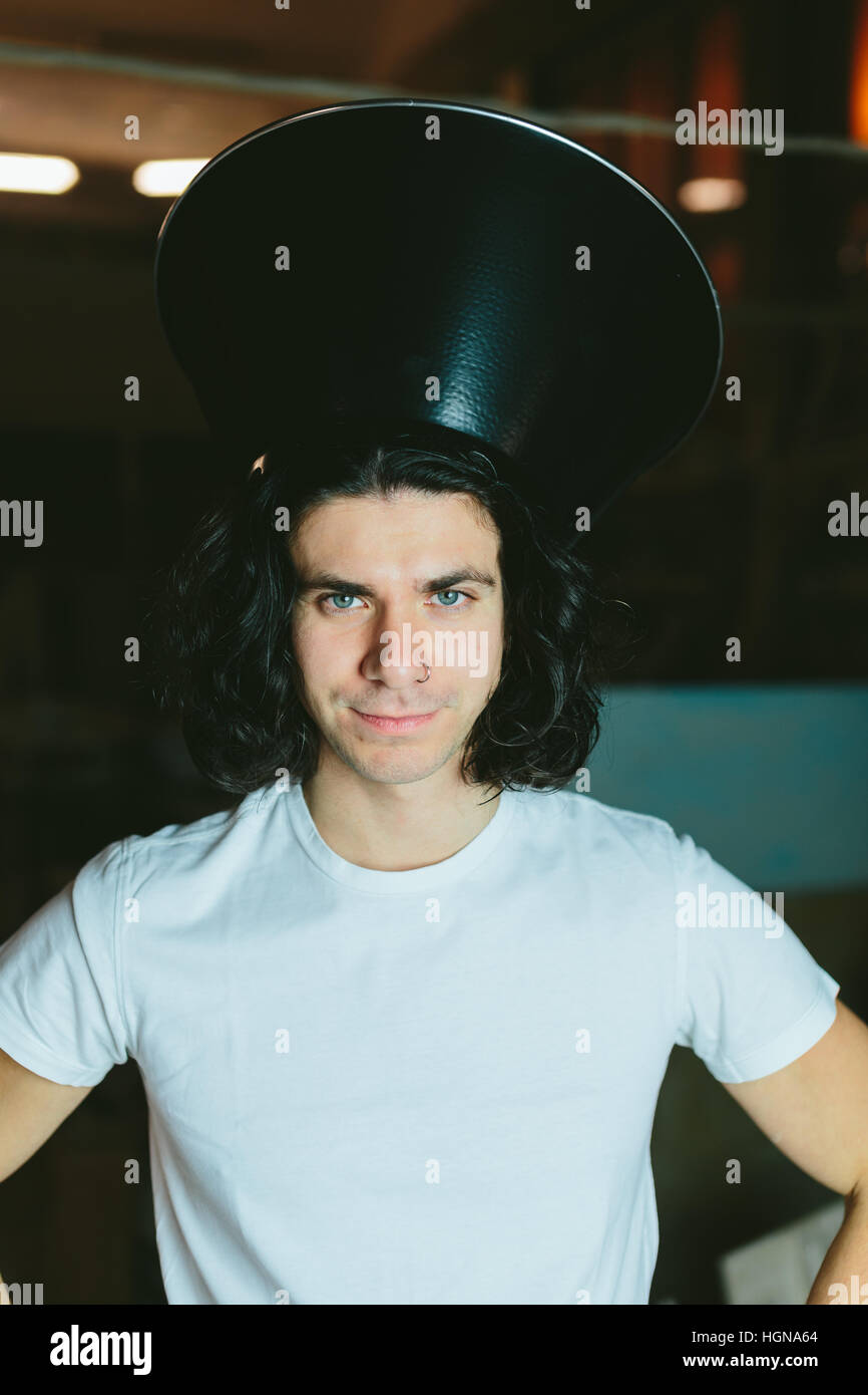 Portrait of a young man in  strange unusual hat Stock Photo
