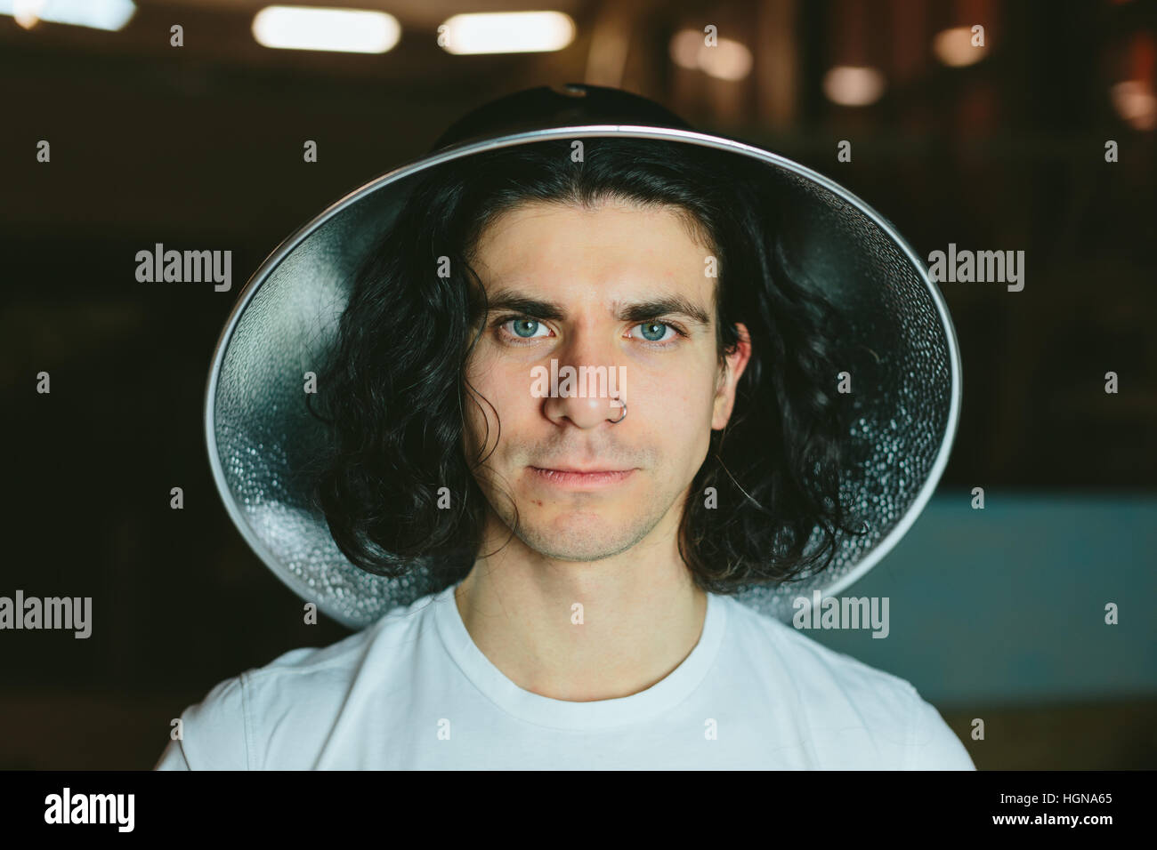 Portrait of a young man in  strange unusual hat Stock Photo