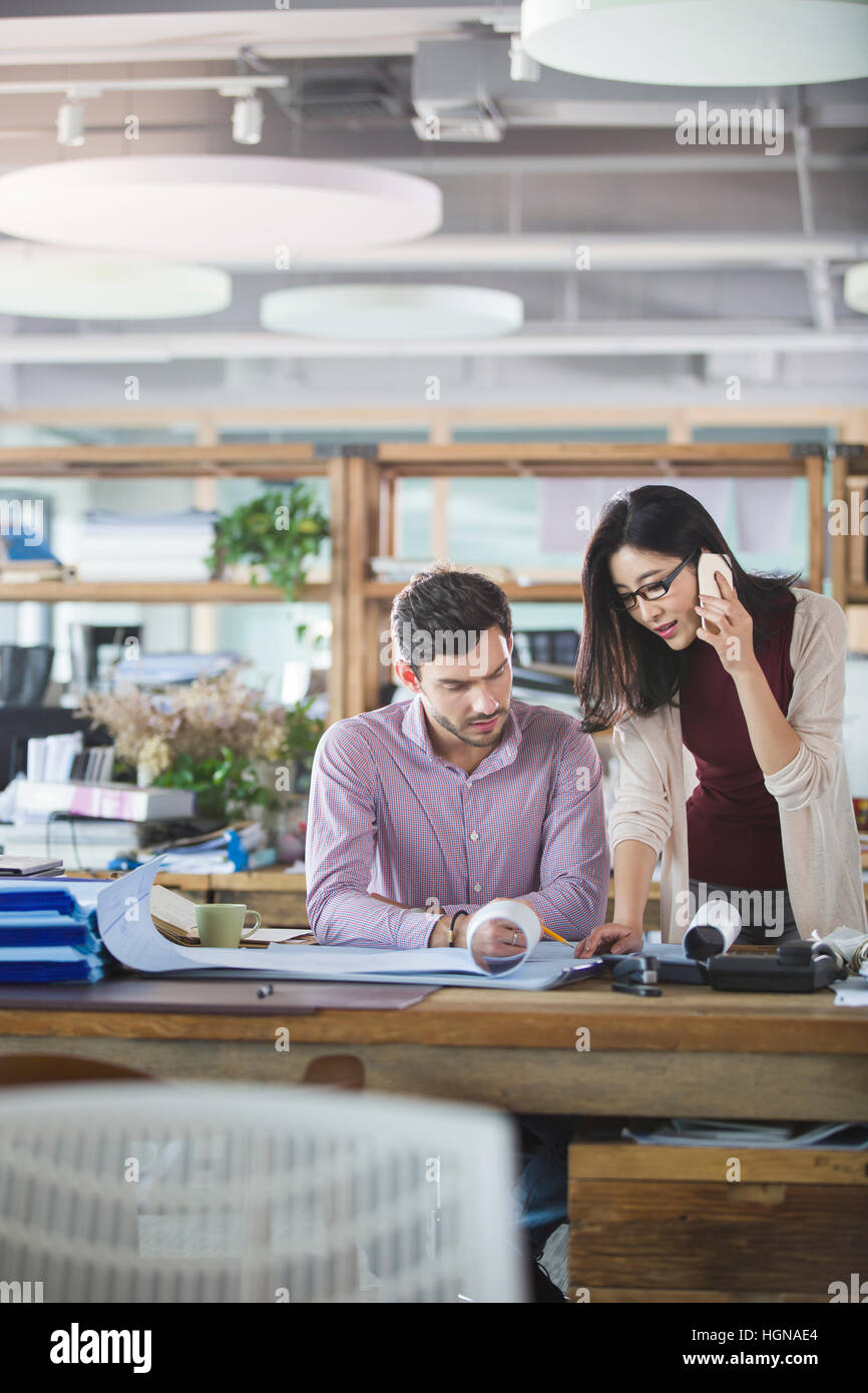 Architects working in busy office hi-res stock photography and images ...