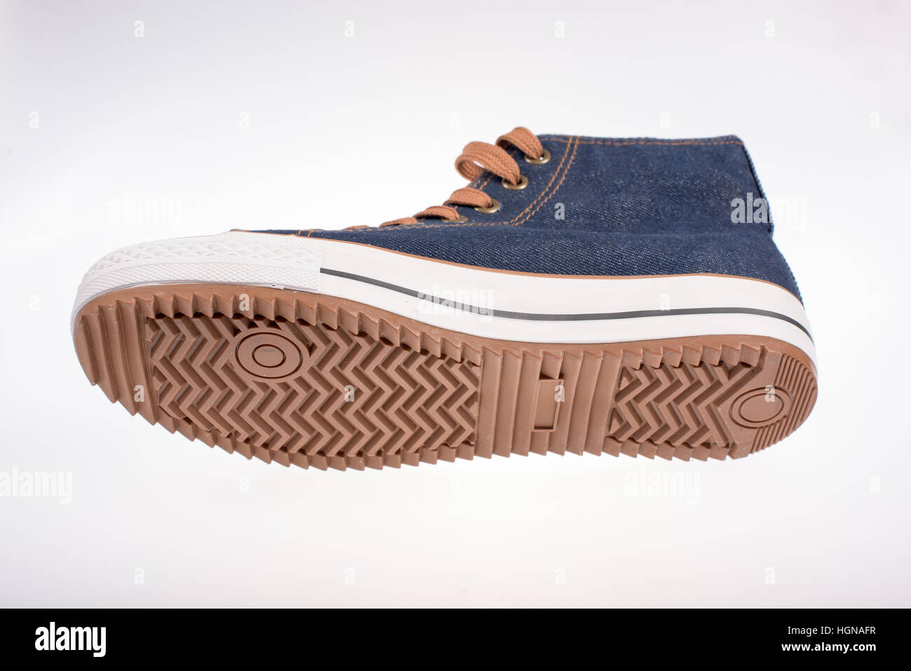Right sneaker made of denim on a white background Stock Photo Alamy