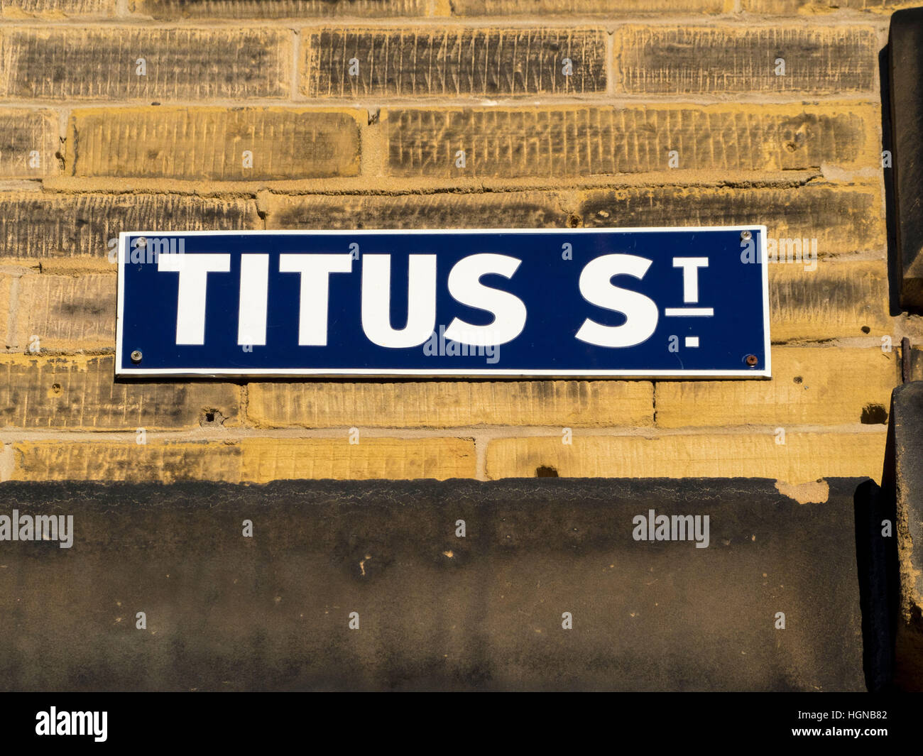 Titus Street sign on wall, Saltaire, West Yorkshire, UK. Stock Photo