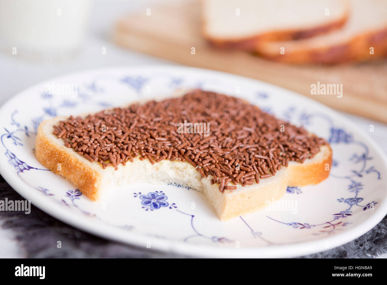 A sandwich with chocolate sprinkles or a 'boterham met hagelslag', Dutch traditional food. Stock Photo