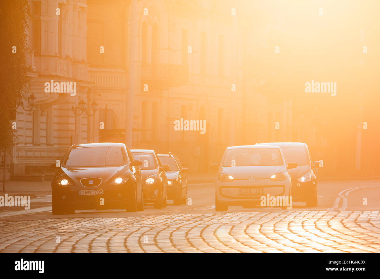 Vilnius, Lithuania  - July 8, 2016: Black Seat Leon And White Volkswagen Eco Up Cars Are At The Head Of Traffic On Zygimantu Street, The Paved Road In Stock Photo
