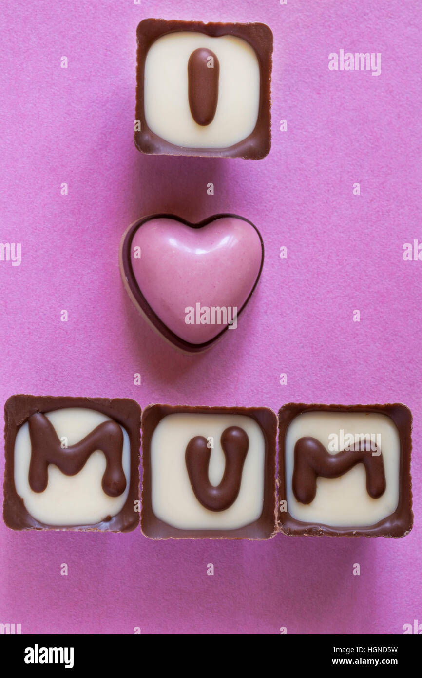 Thorntons I love Mum chocolates removed from box, part of present for Mothers Day, Mothering Sunday on pink background Stock Photo