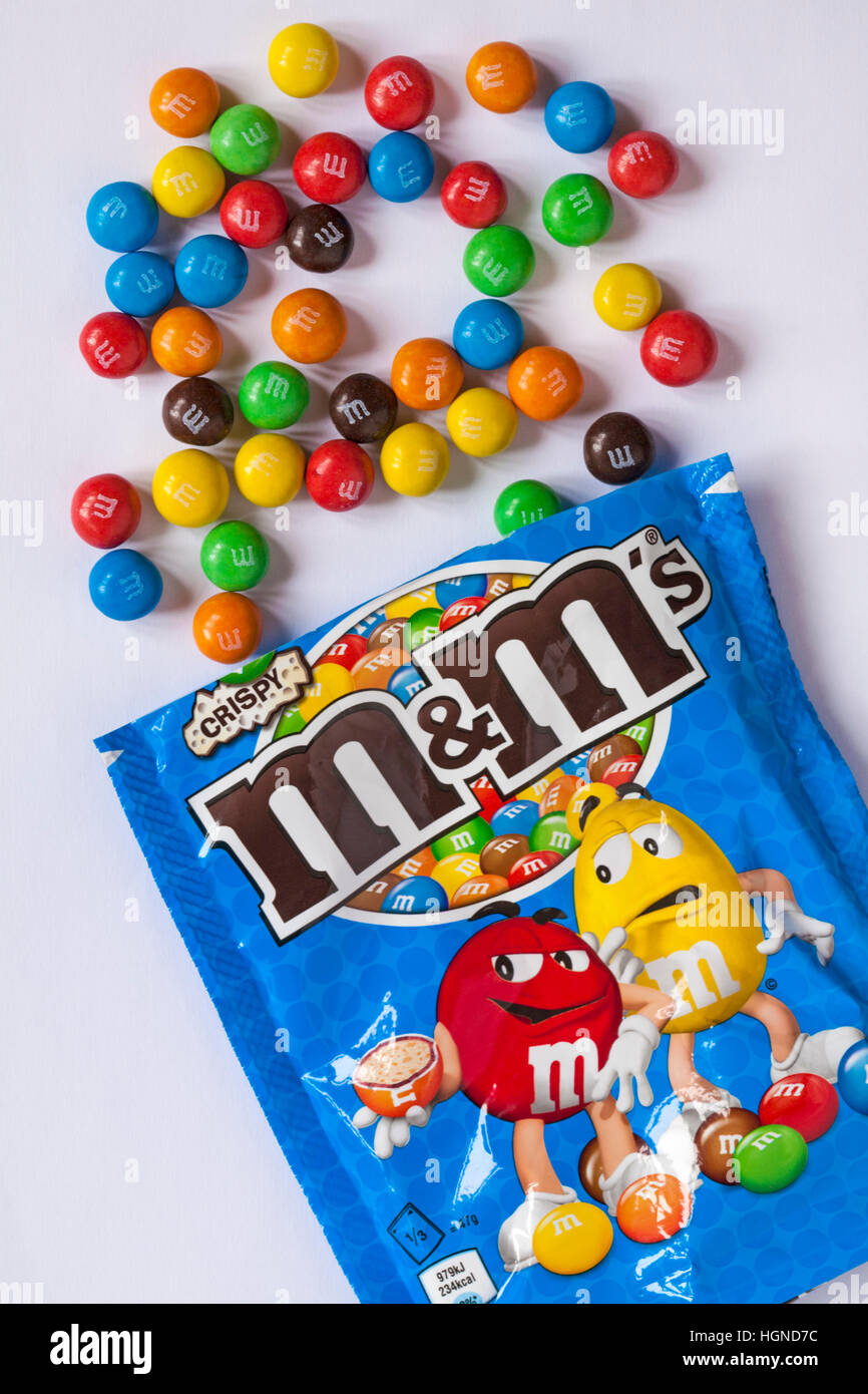Packet of limited edition crunchy caramel M&Ms isolated on white background  Stock Photo - Alamy