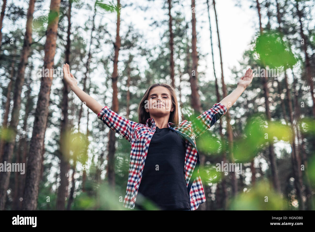 Young woman embracing the natural world around her Stock Photo