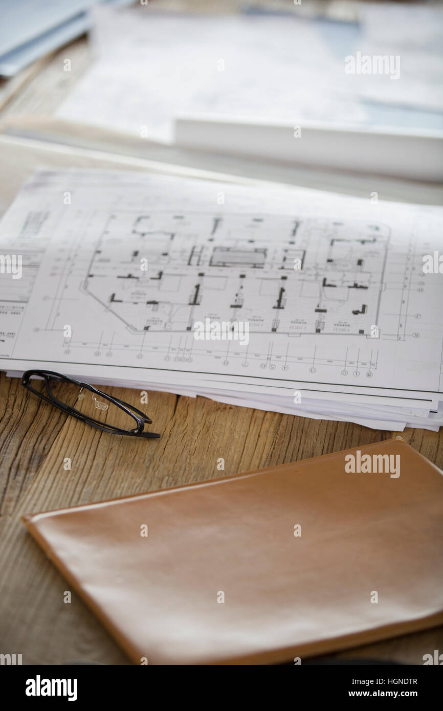 Blueprints on office desk Stock Photo Alamy