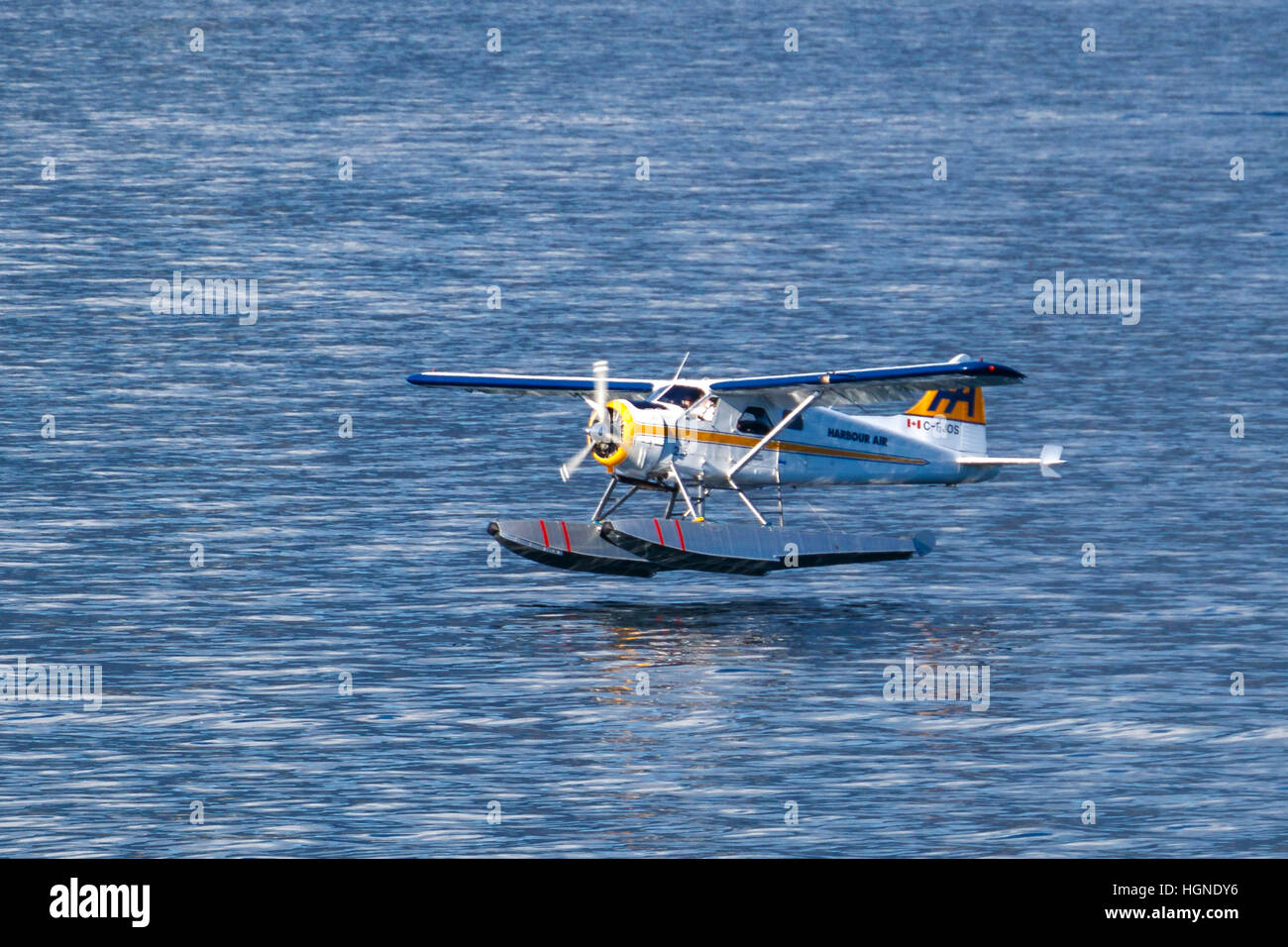 A  De Havilland Beaver Harbour Air seaplane takes off from Vancouver horbour, British Columbia, Canada. Stock Photo