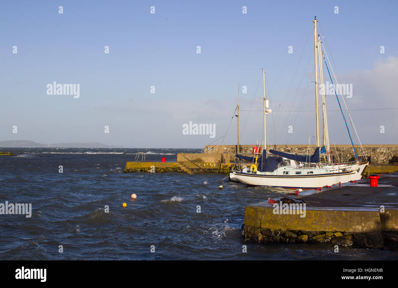 Boats on their moorings during a winter storm in the Irish Sea at Groomsport in County Down  Northern Ireland Stock Photo