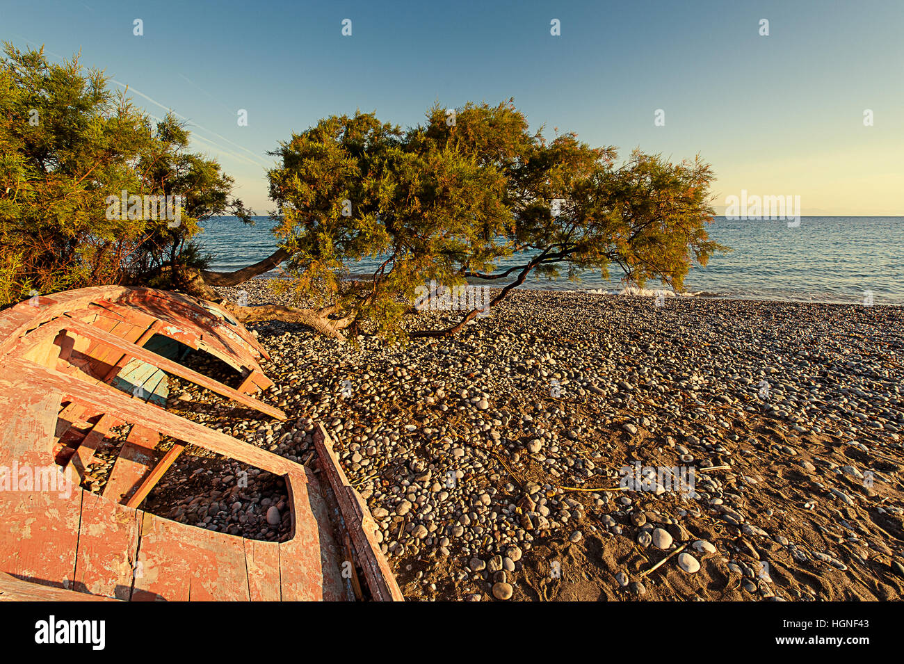 Old wooden boat on beach sunset hi-res stock photography and images - Alamy