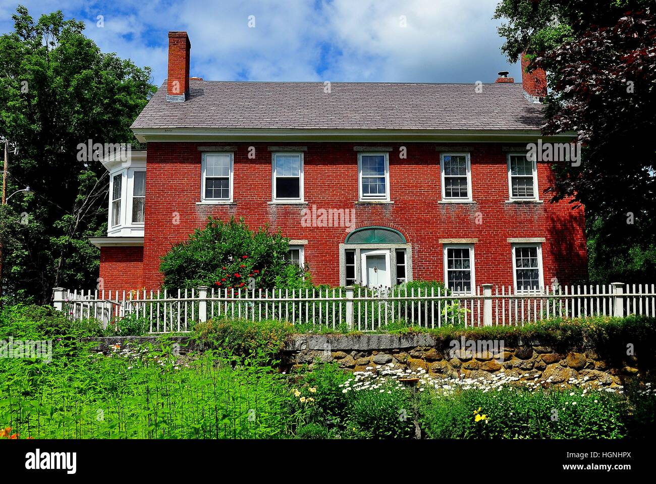 Harrisville, New Hampshire Early 19th century brick home with picket