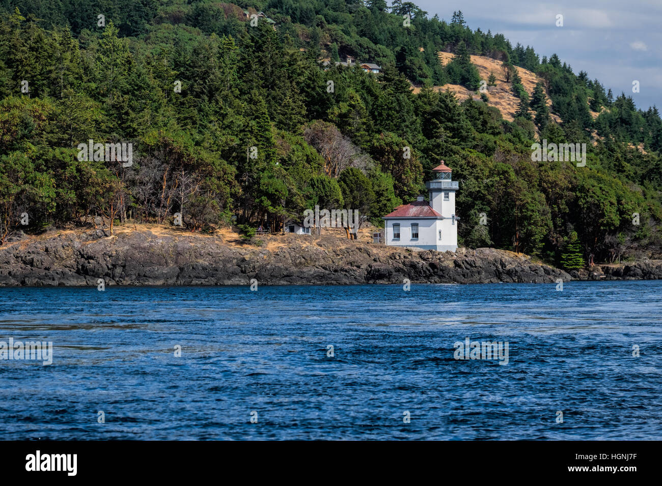 Lime Kiln Light. on San Juan Island, Washington, guides ships though the Haro Straits and is a part of Lime Kiln State Park. Stock Photo