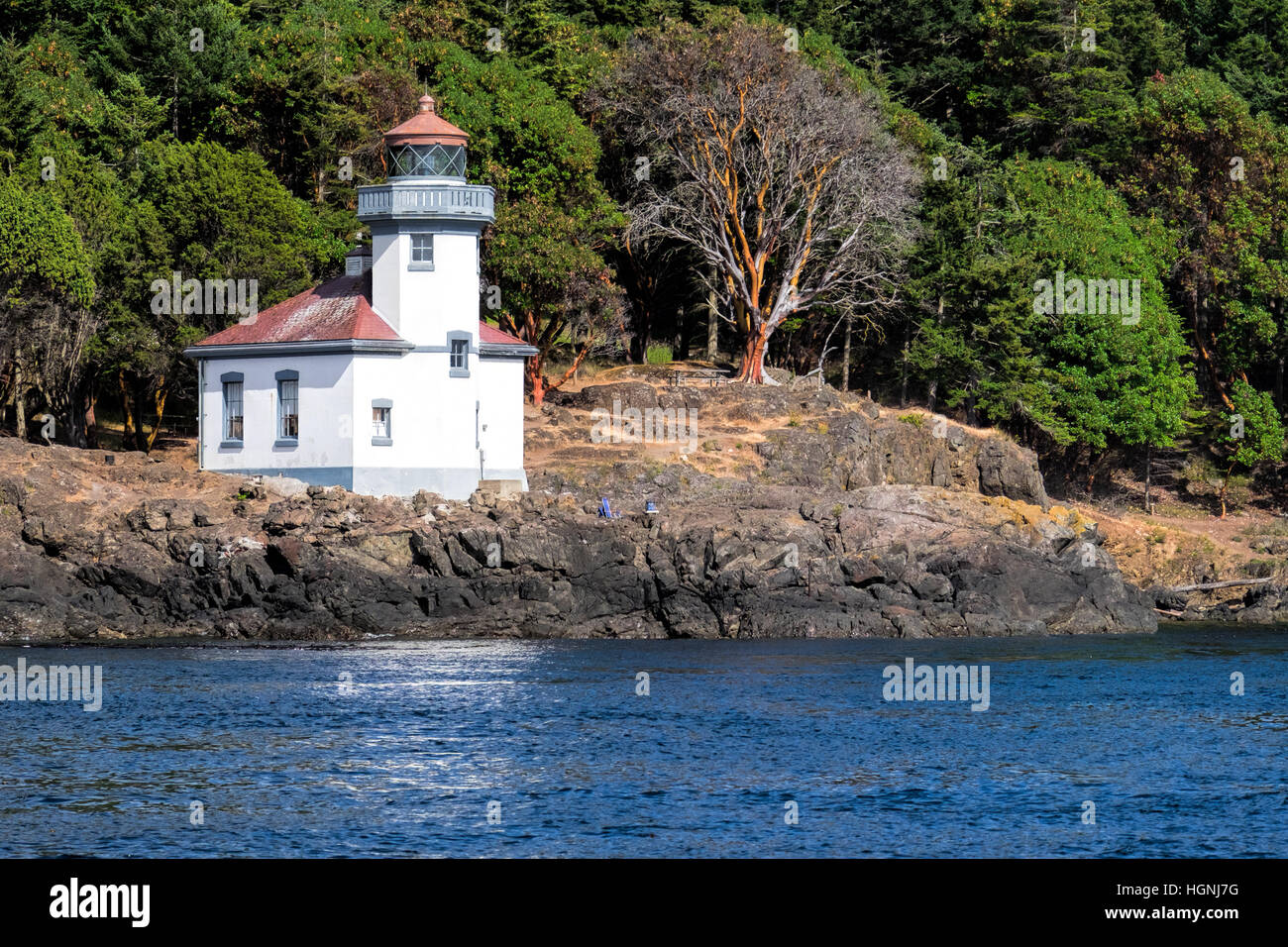 Lime Kiln Light. on San Juan Island, Washington, guides ships though the Haro Straits and is a part of Lime Kiln State Park. Stock Photo