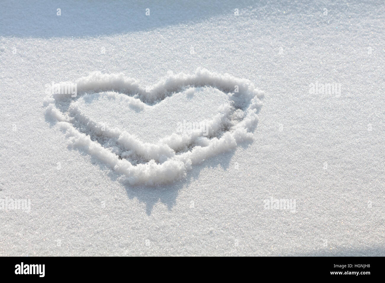 Hand drawn heart out in the snow Stock Photo - Alamy