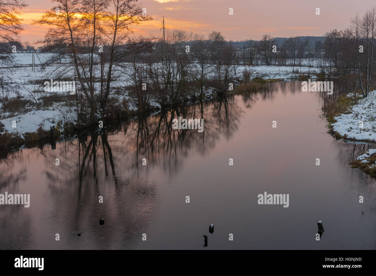Pictorial evening landscape with Hrun' river at winter sunset time, Poltavskaya oblast,  Ukraine Stock Photo