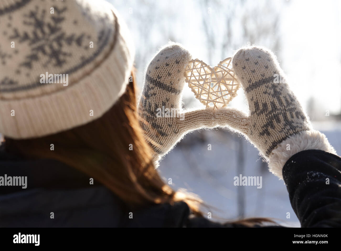 Woman holding hands in a heart shape Stock Photo