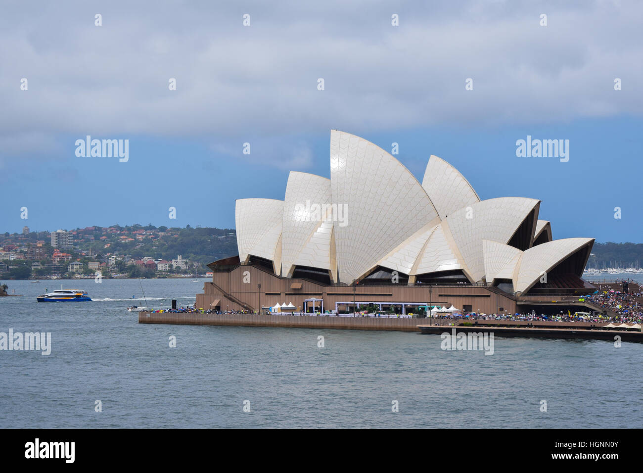 The Sydney Opera House SOH on Bennelong Point next to the Sydney Harbor Bridge and Harbor in Australia, New South Wales Stock Photo