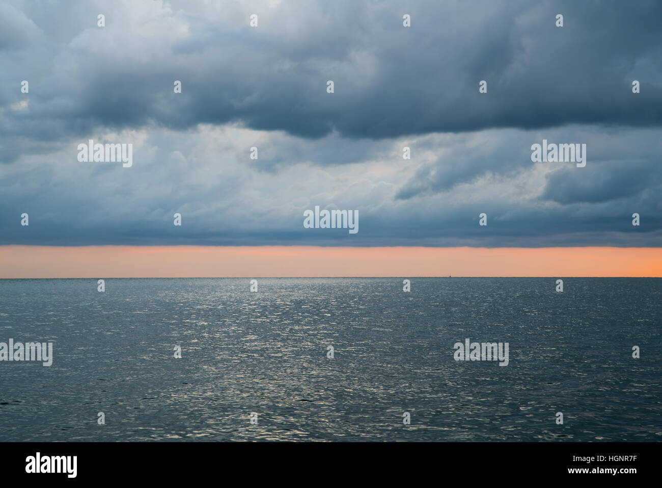 Cloudy stormy dramatic sky over the sea with sunlight Stock Photo - Alamy