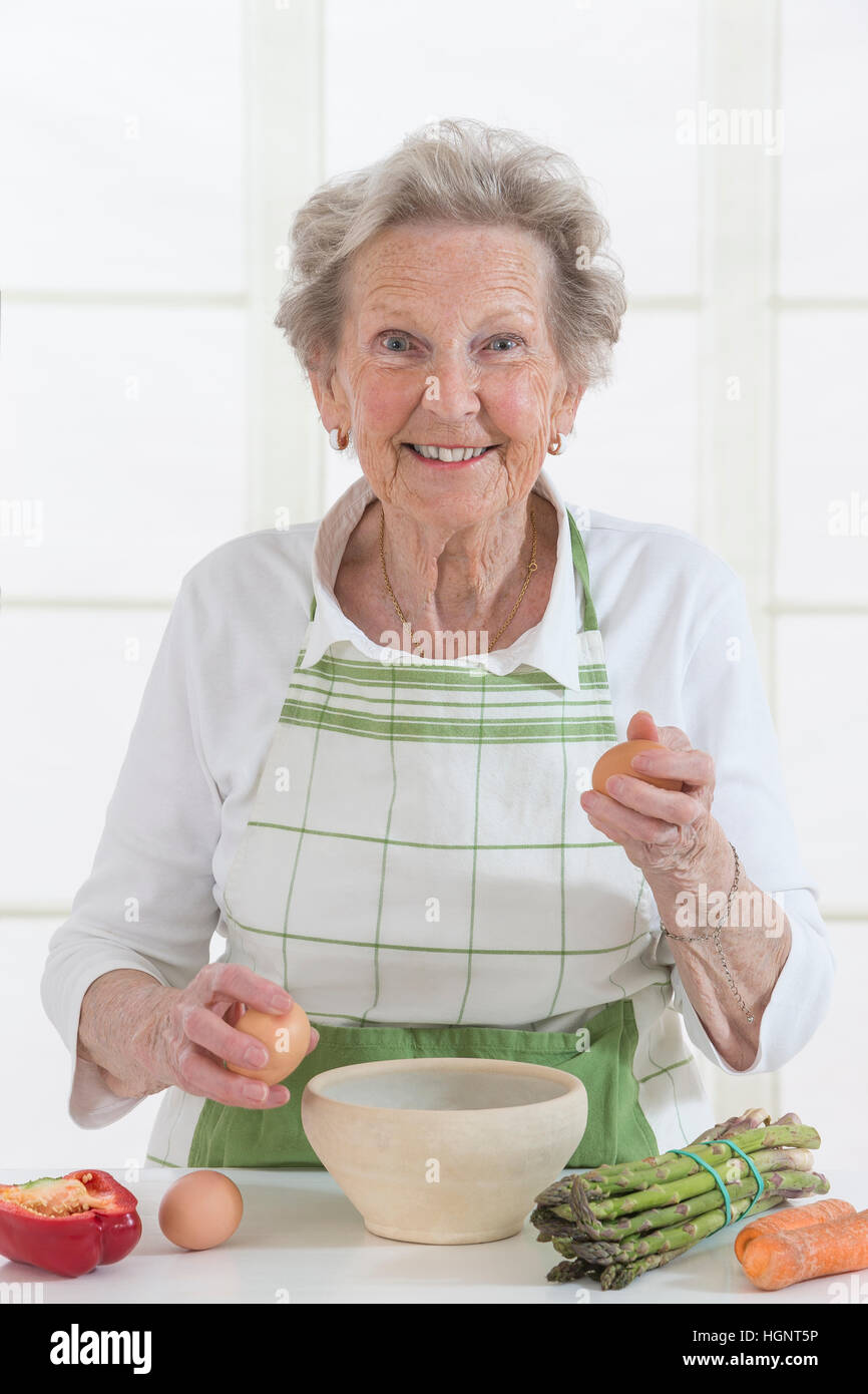 SENIOR IN KITCHEN Stock Photo