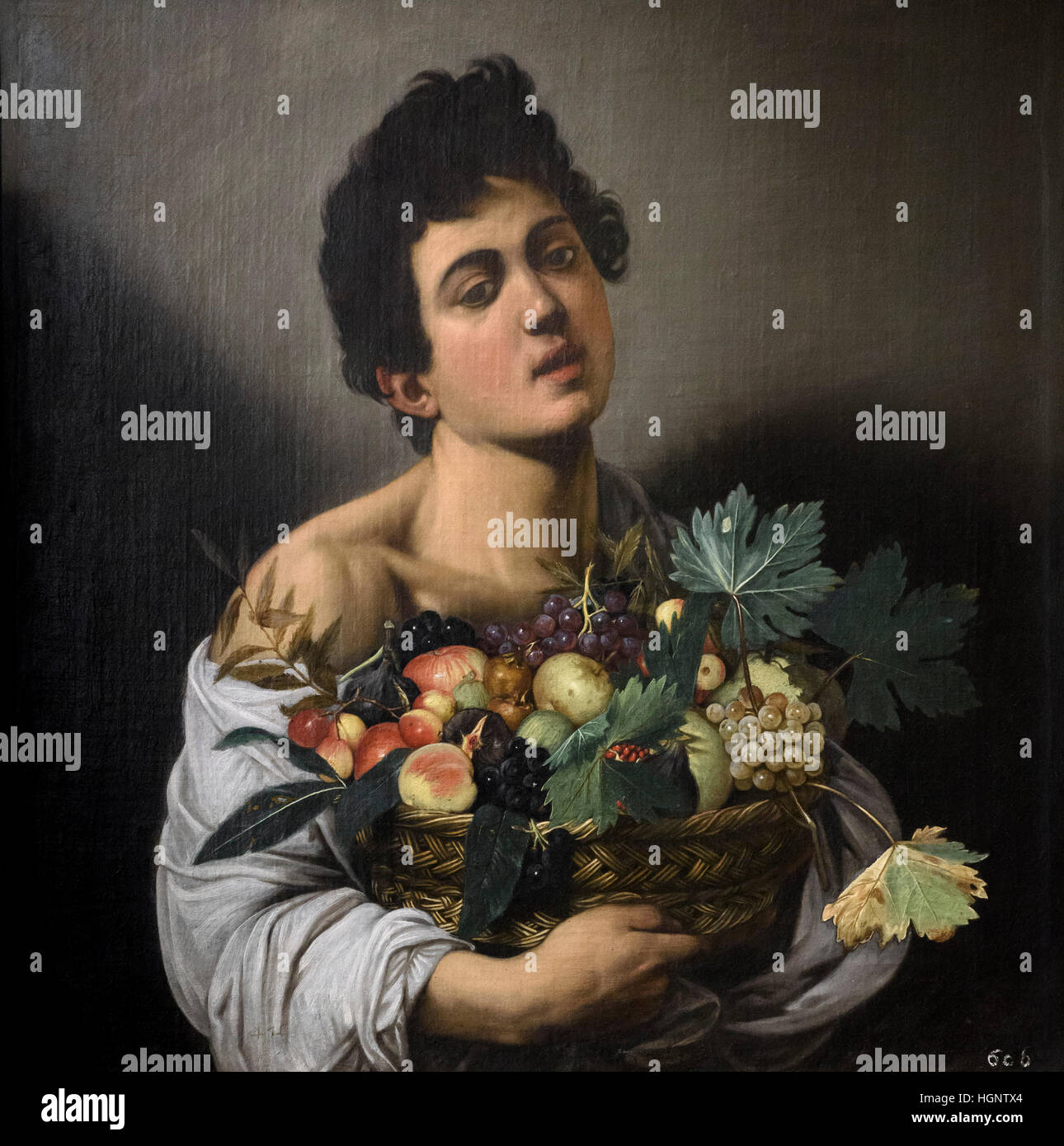 Caravaggio - Michelangelo Merisi (1571-1610) Boy with a Basket of Fruit, ca. 1593. Giovane con canestro di frutta. Stock Photo