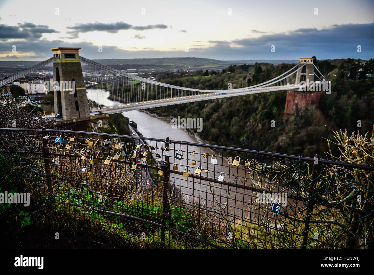 Padlocks locked on a metal fence overlooking Clifton Suspension Bridge