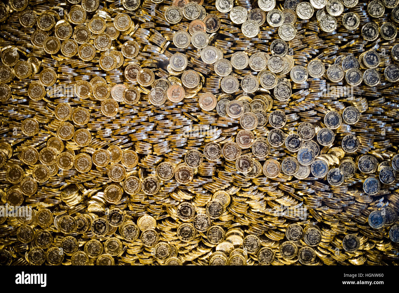 Glass display containing million coins hi res stock photography