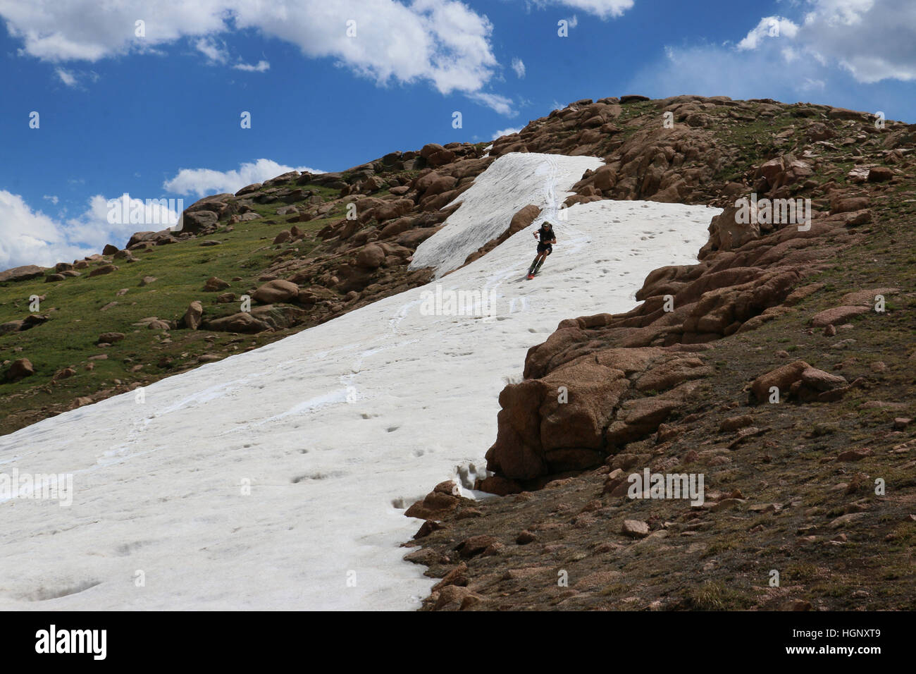 Skier on snow field Pikes Peak Rocky Mountain National ridge Colorado Stock Photo