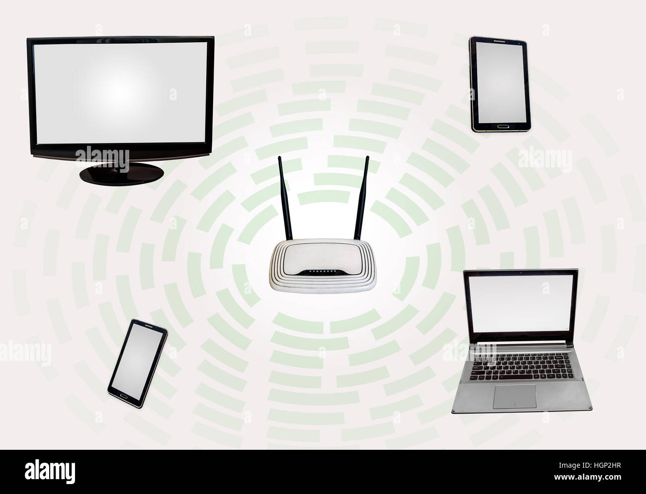 Wireless Internet connectivity zone with router desktop monitor laptop tab smart phone isolated in white. Stock Photo